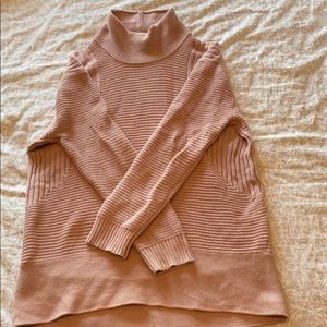 Loose, long turtleneck sweater